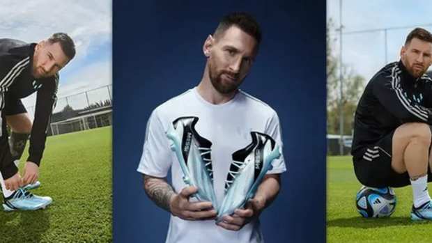 Lionel Messi models blue and black adidas soccer shoes.